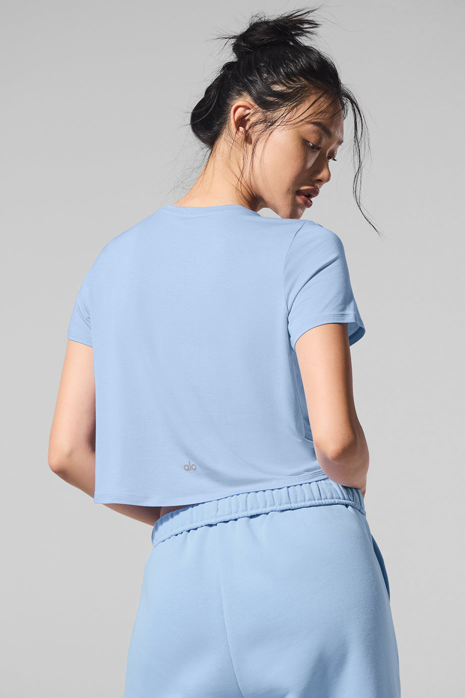 Seashell Blue cropped short sleeve top styled with high-waisted jeans