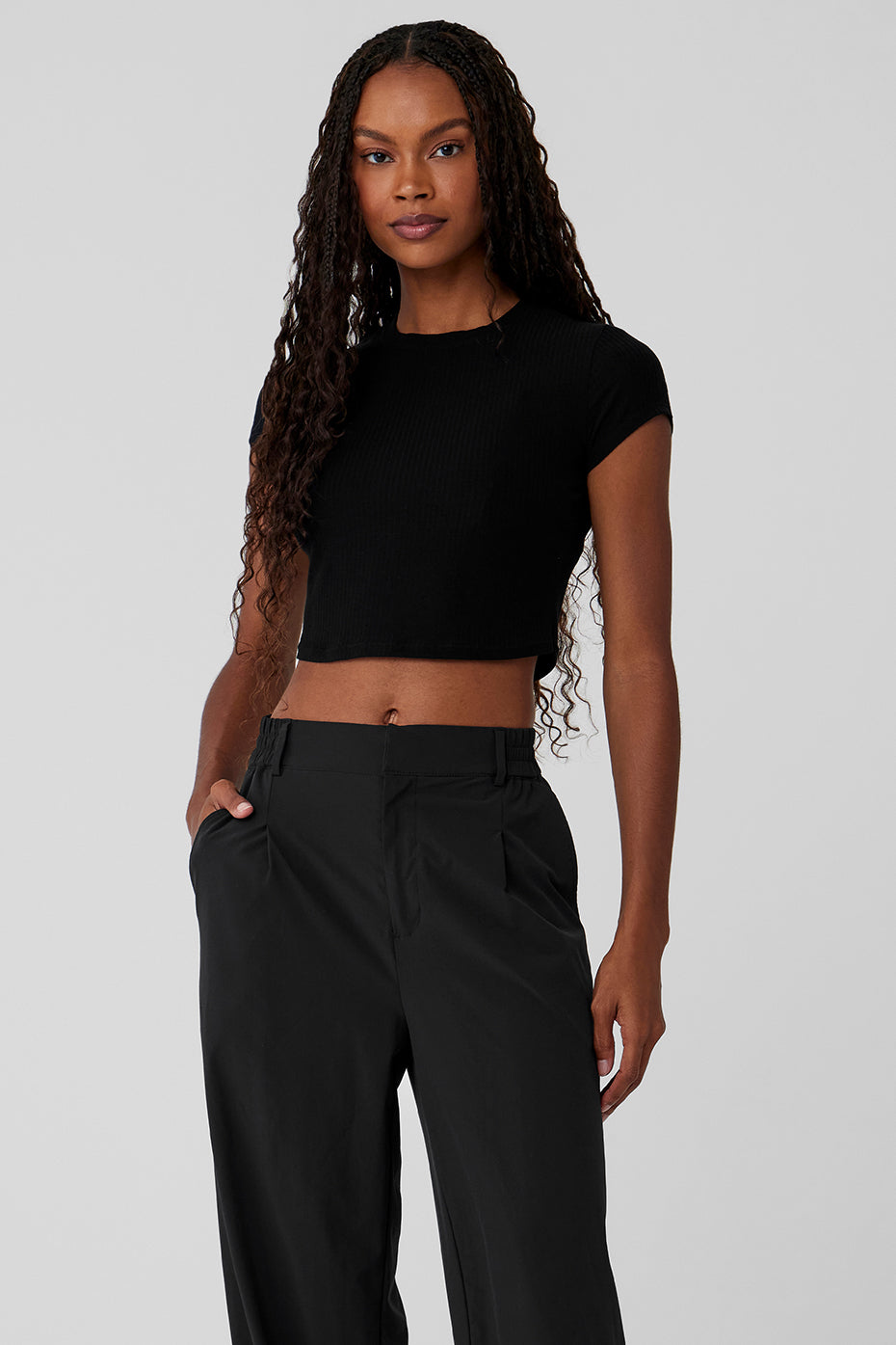 Front view of black ribbed cropped tee with cap sleeves, ideal for casual wear