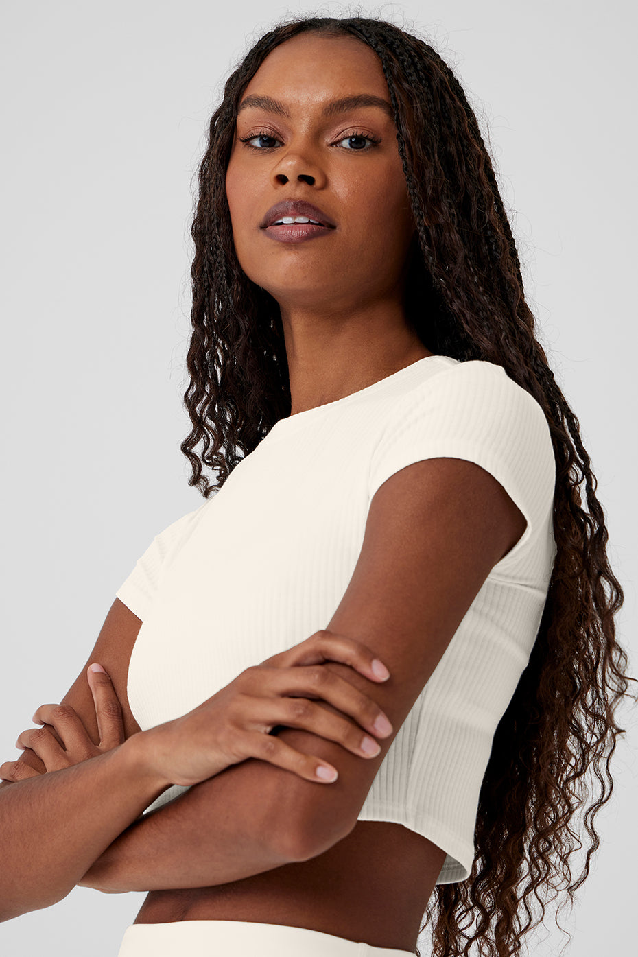 Front view of the ivory cropped tee, showcasing its ribbed texture.
