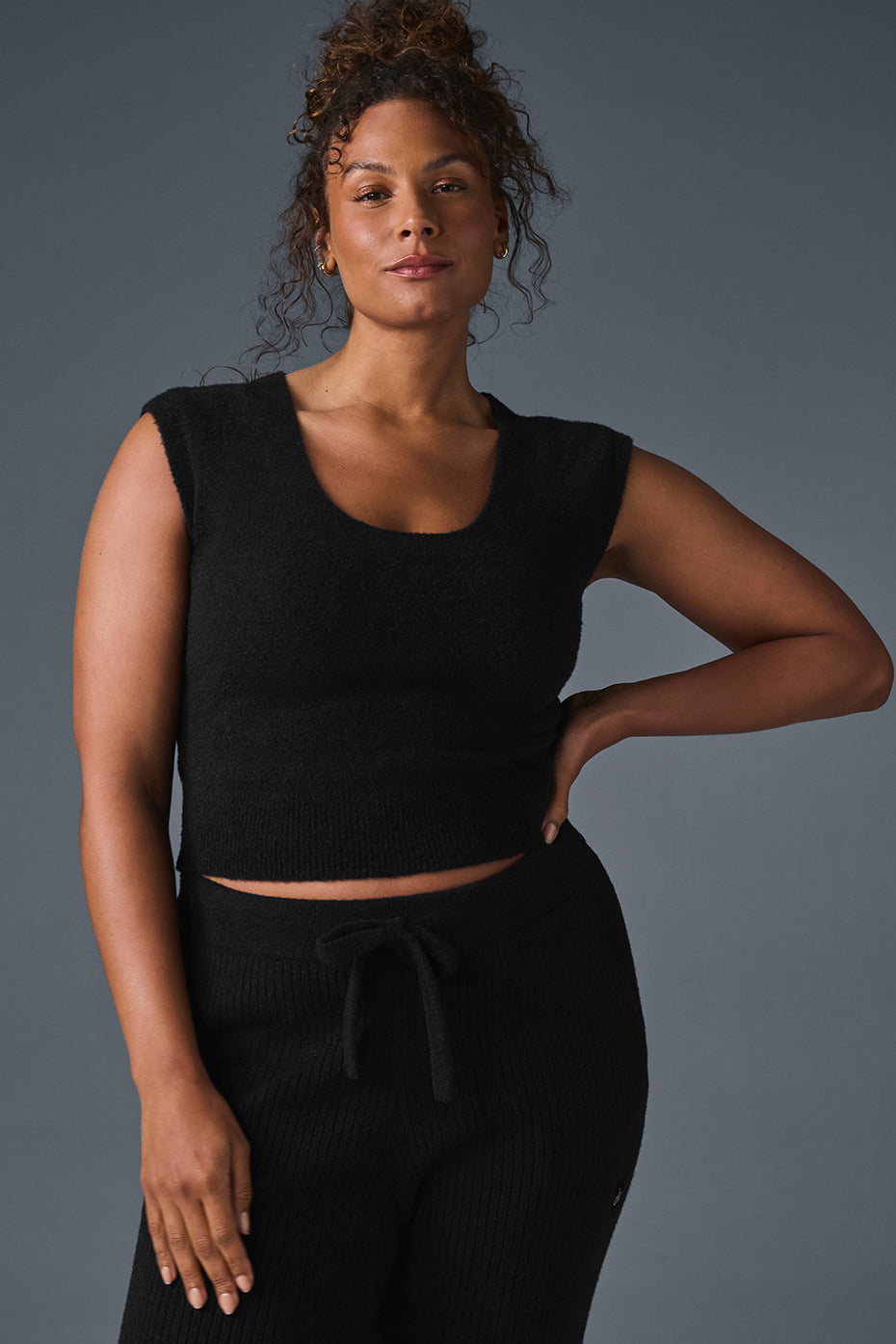 Lifestyle shot of black and white sweater collection for casual wear