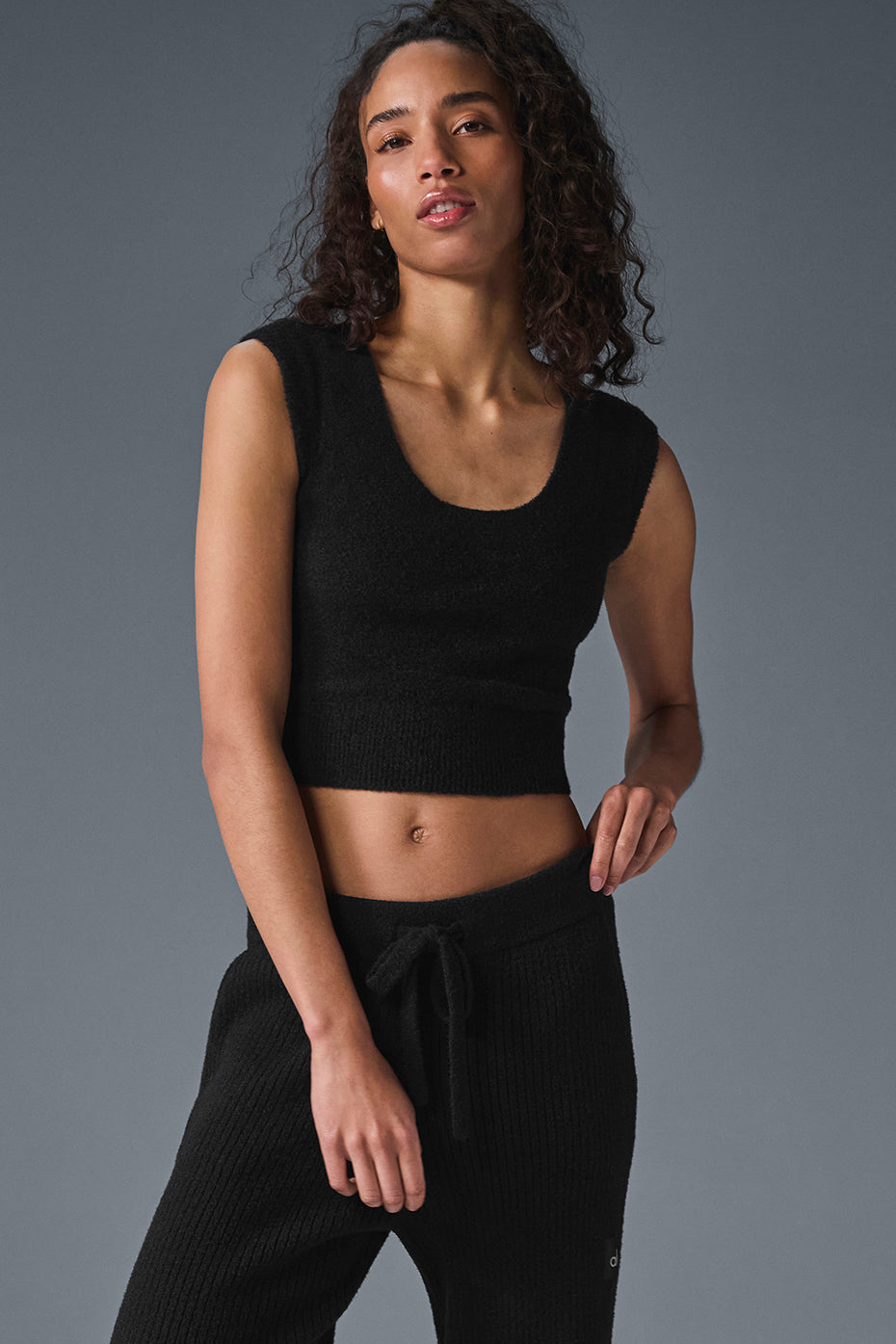 Front view of black sweater women style paired with trousers