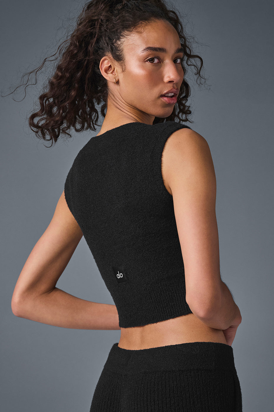 Lifestyle shot of black and white sweater collection for casual wear