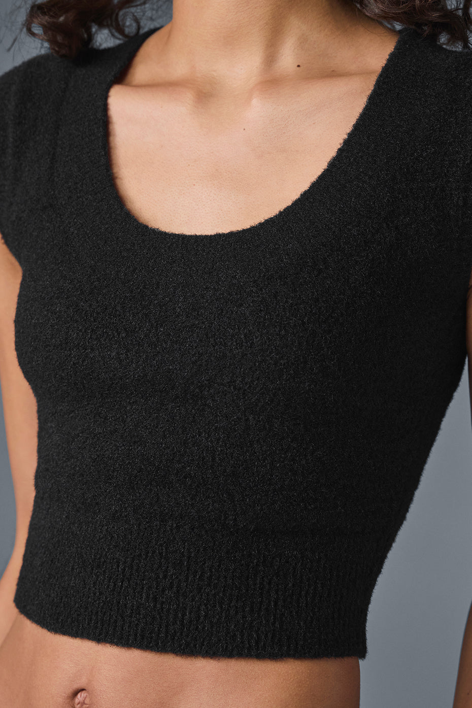 Front view of black sweater women style paired with trousers