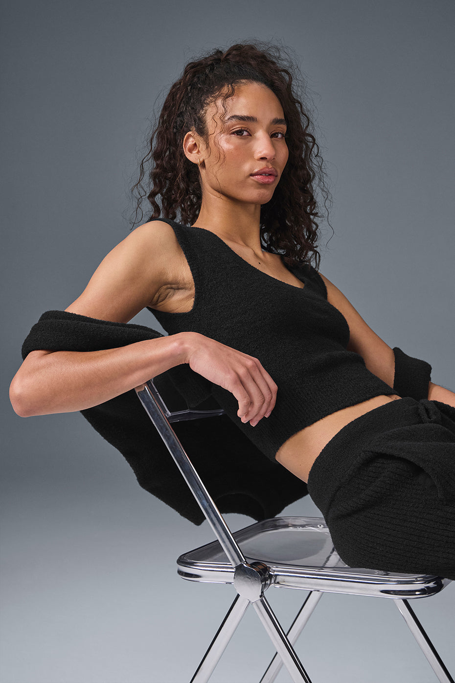 Side angle of short sleeve sweater showing scooped neckline detail