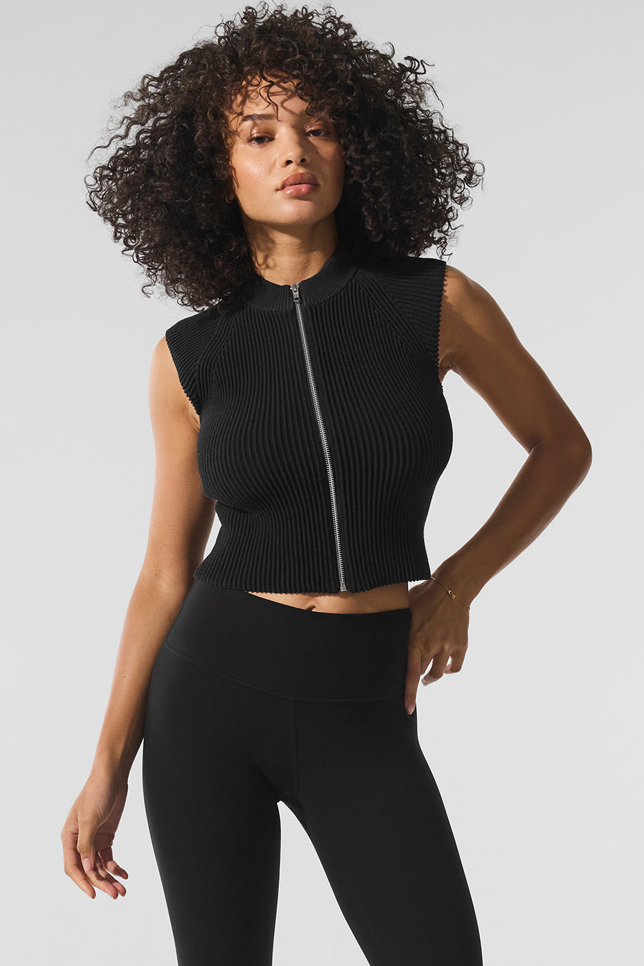 Model wearing corset denim tops at night with layered outerwear, ideal for evening plans