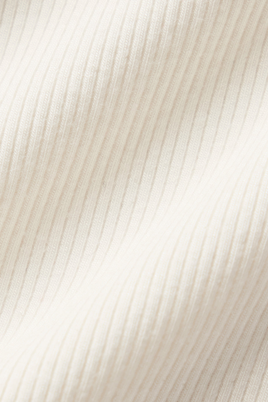 Side view of the mock neck crop top, showcasing its flattering fit.