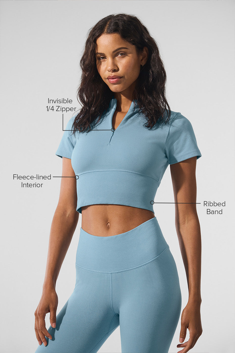 Stylish plush cropped winter top paired with jeans.