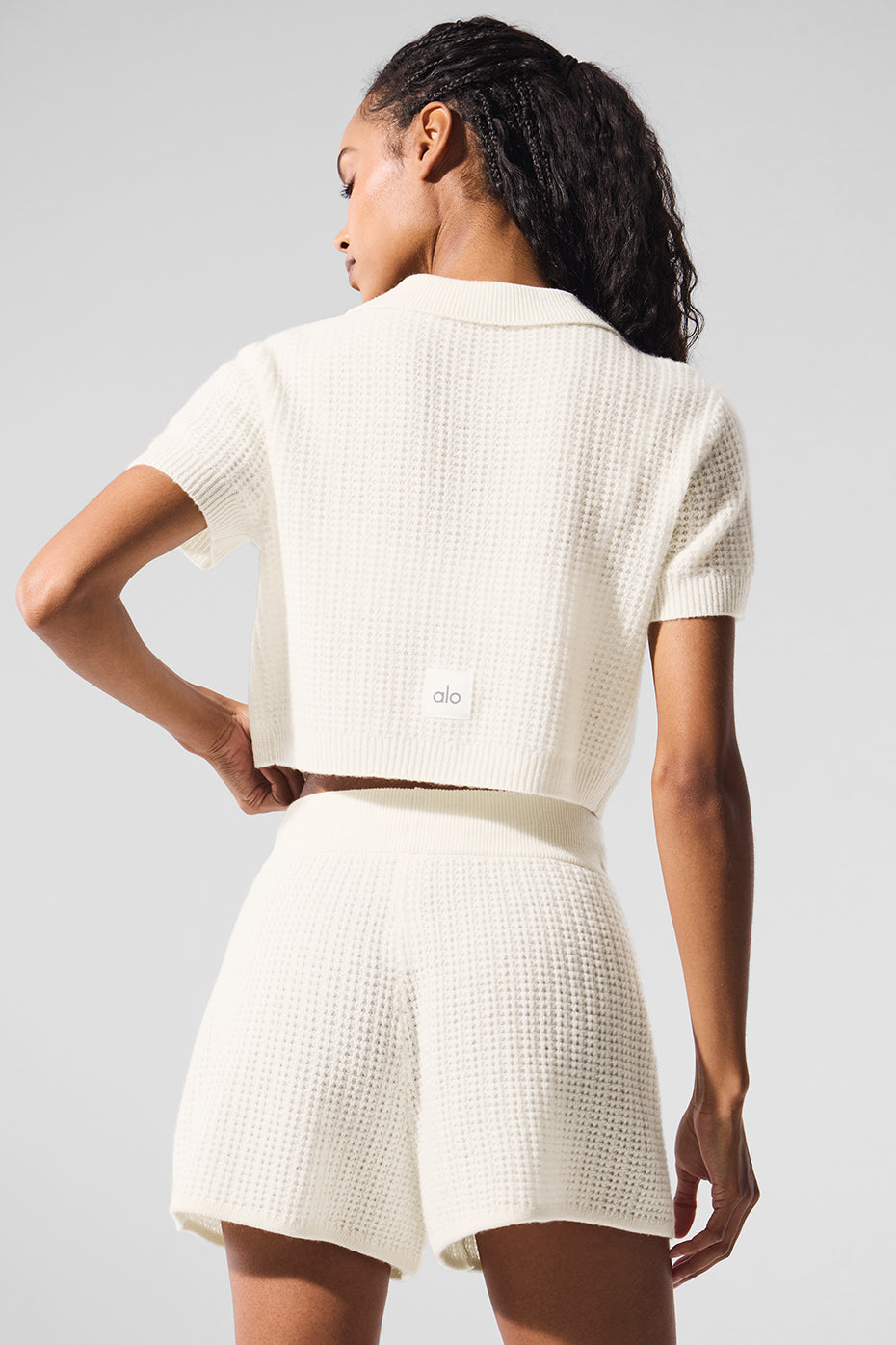 Stylish cashmere polo shirt paired with matching shorts for a chic summer look.