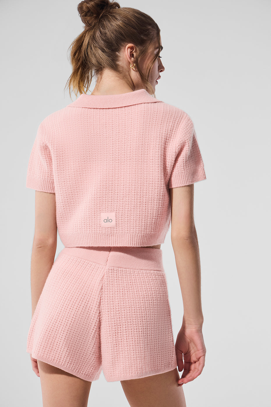 Close-up of waffle knit texture on cashmere polo shirt.