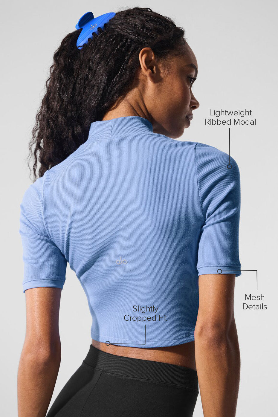 Side angle showing mesh sleeves on casual t-shirt