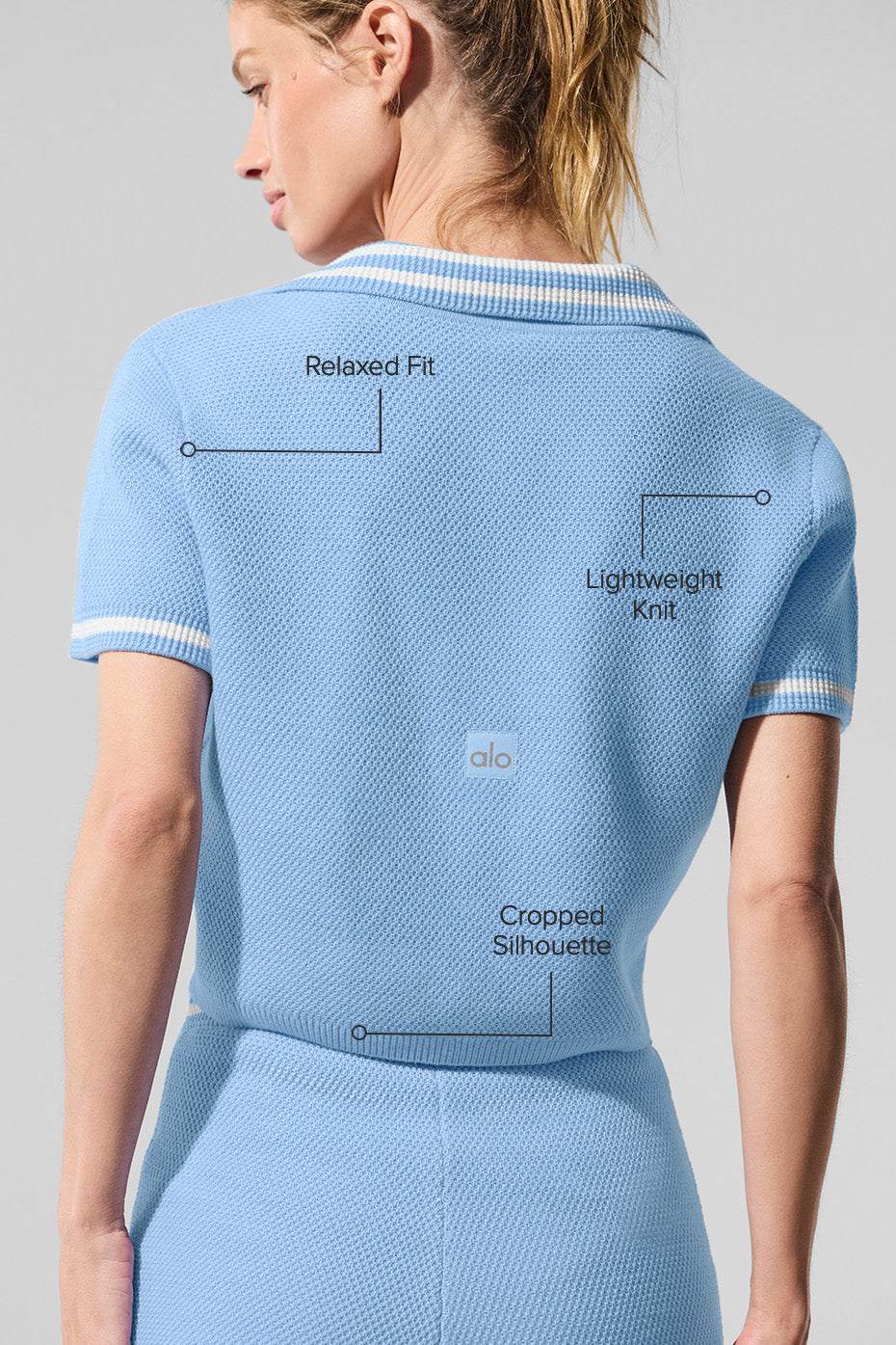 Side view showcasing the structured collar of the cropped polo.