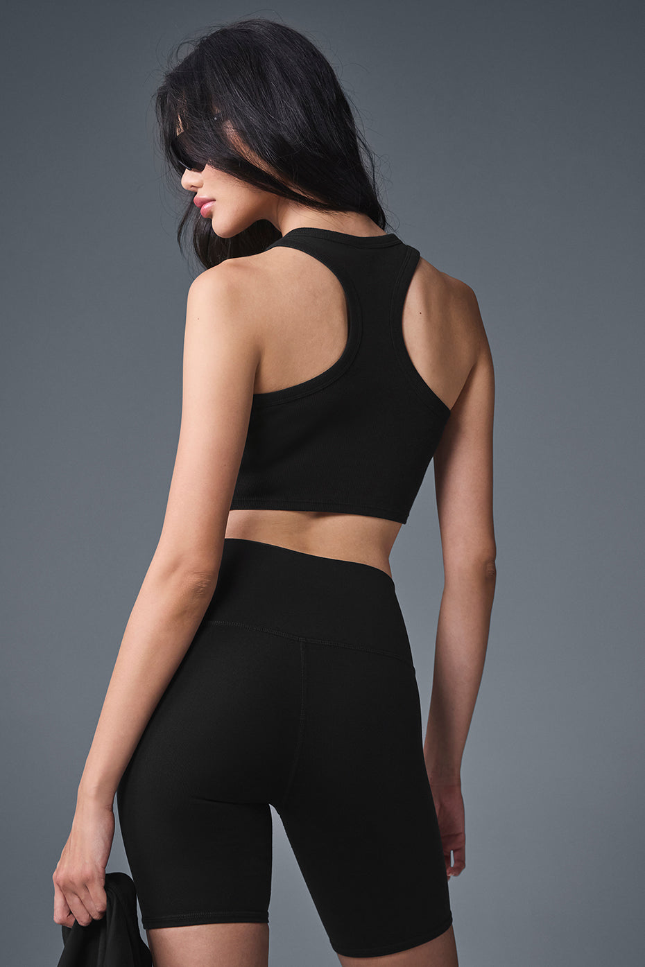 Close-up detail of black Aspire Tank neckline from 437 activewear collection.