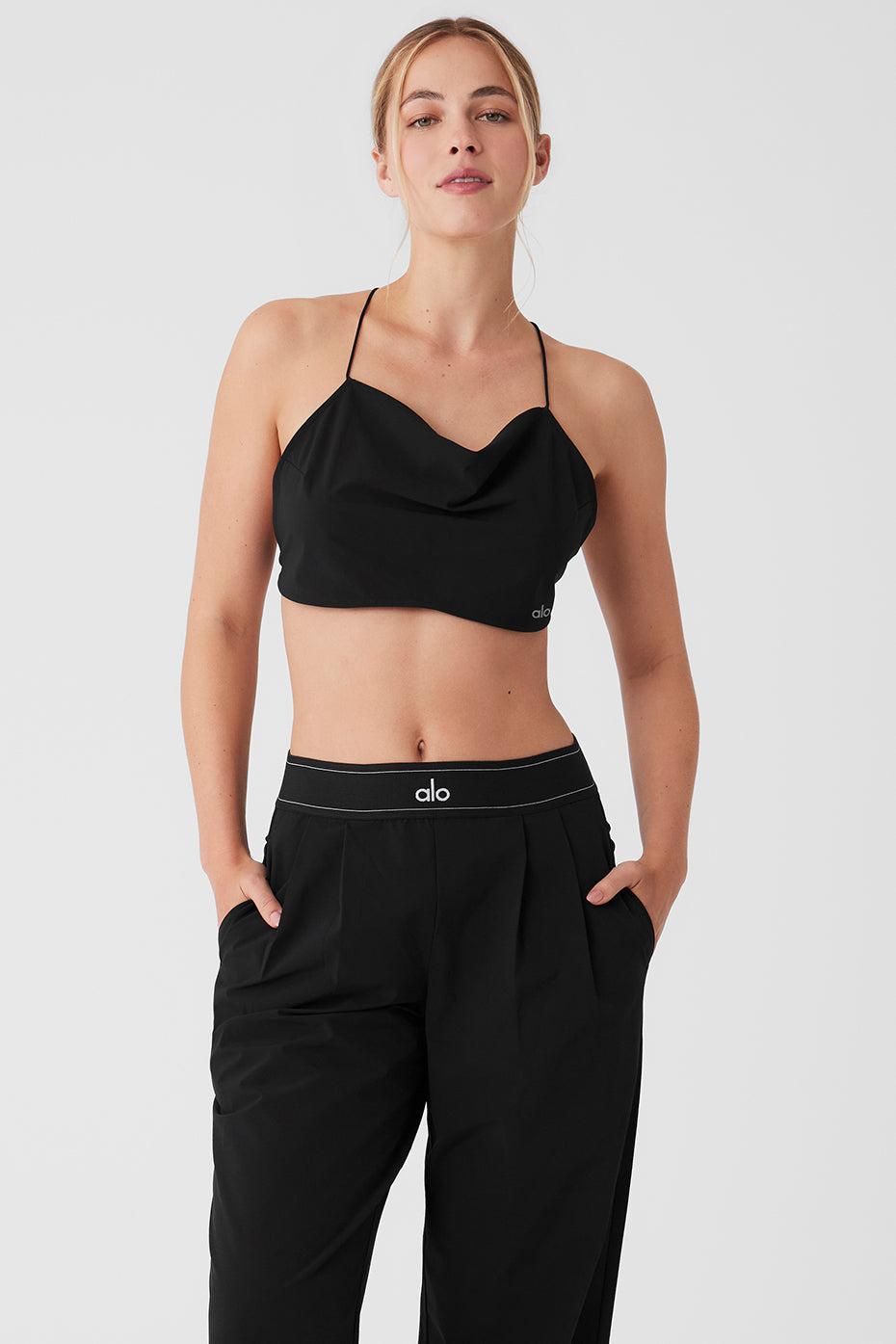 Front angle of black cropped tank featuring cowl neck detailing