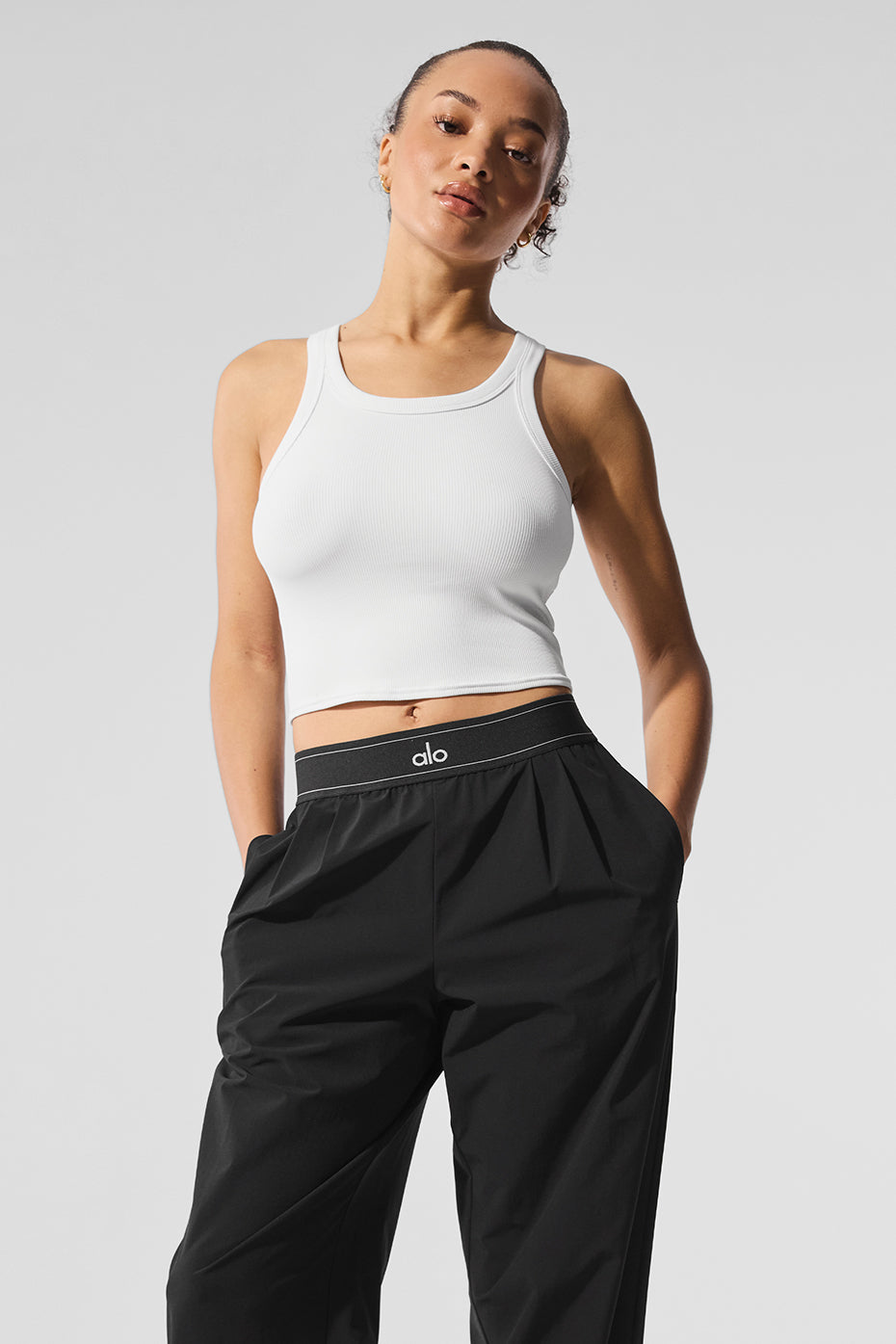 Side view showcasing the racerback design of the white tank top.