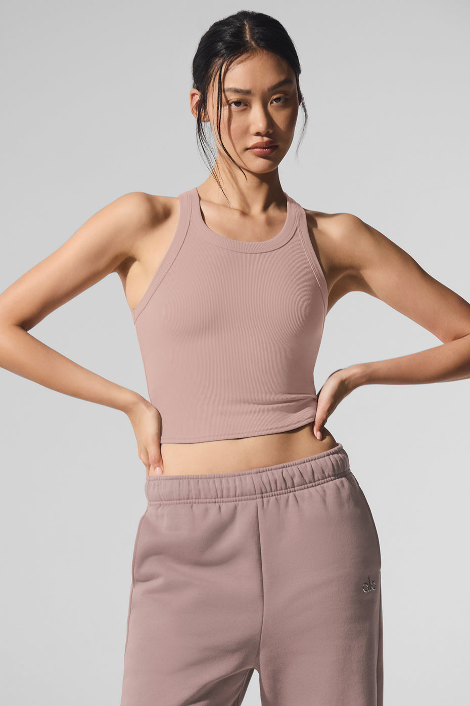 Front view of Goddess Ribbed Performance Tank in taupe, perfect for layering.
