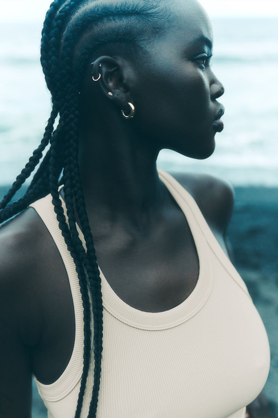 Front view of Goddess Ribbed Tank in Macadamia, showcasing the racerback design.