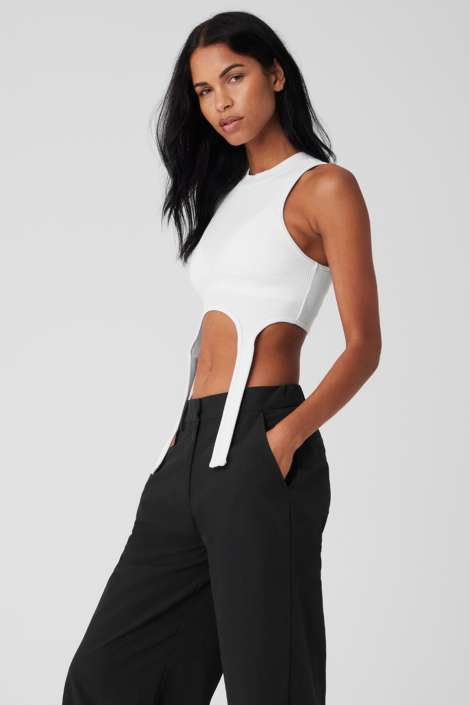 Cropped tank top layered under a blazer for workwear
