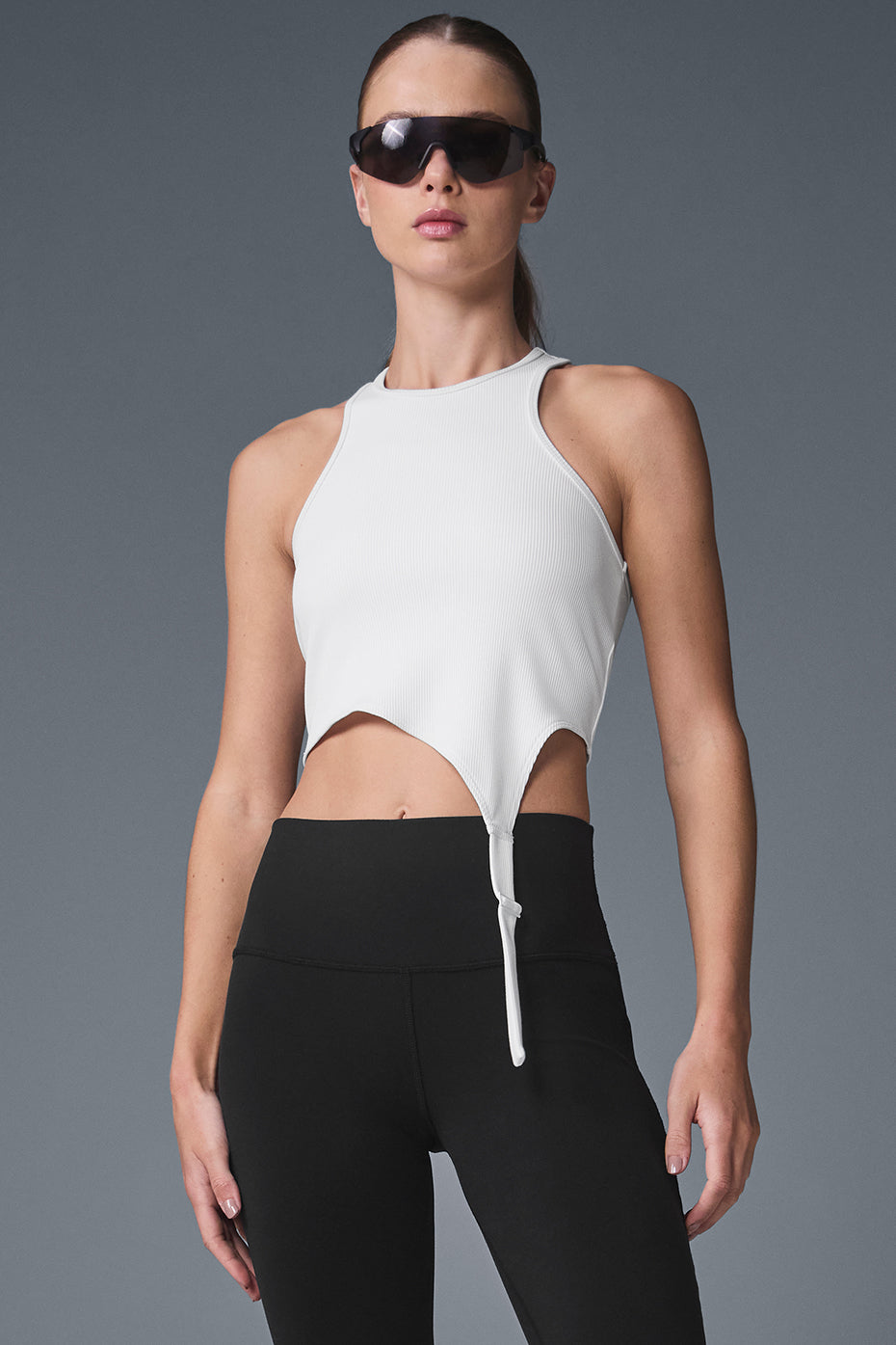 Front view of the Alosoft Ribbed Edge Crop Tank in white, highlighting the buckle straps.