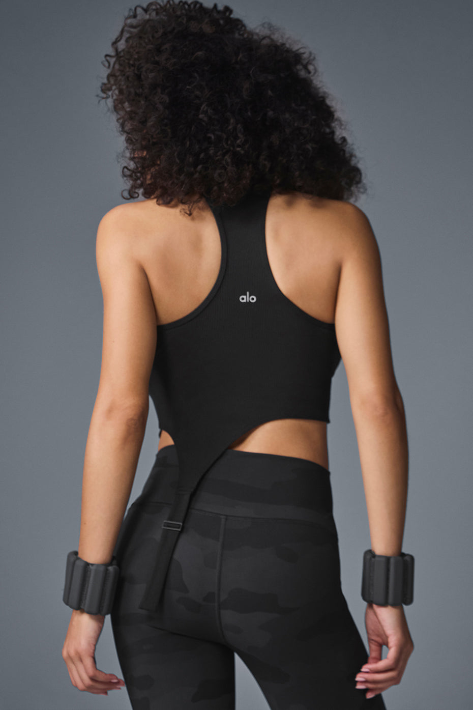 Close-up of racerback tank feature with buckle strap detail