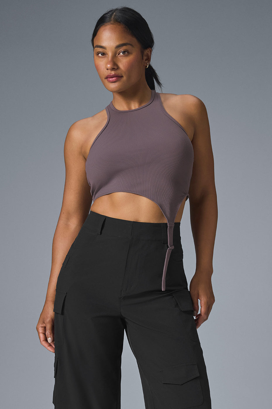 Front view of the asymmetric tank top with buckle straps in Raisinette color