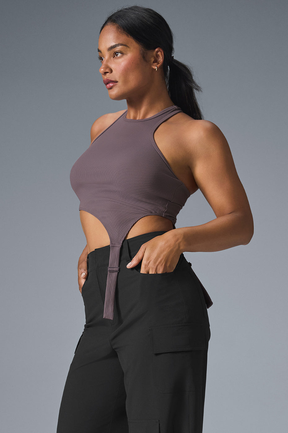 Close-up of the ribbed fabric texture and asymmetric silhouette