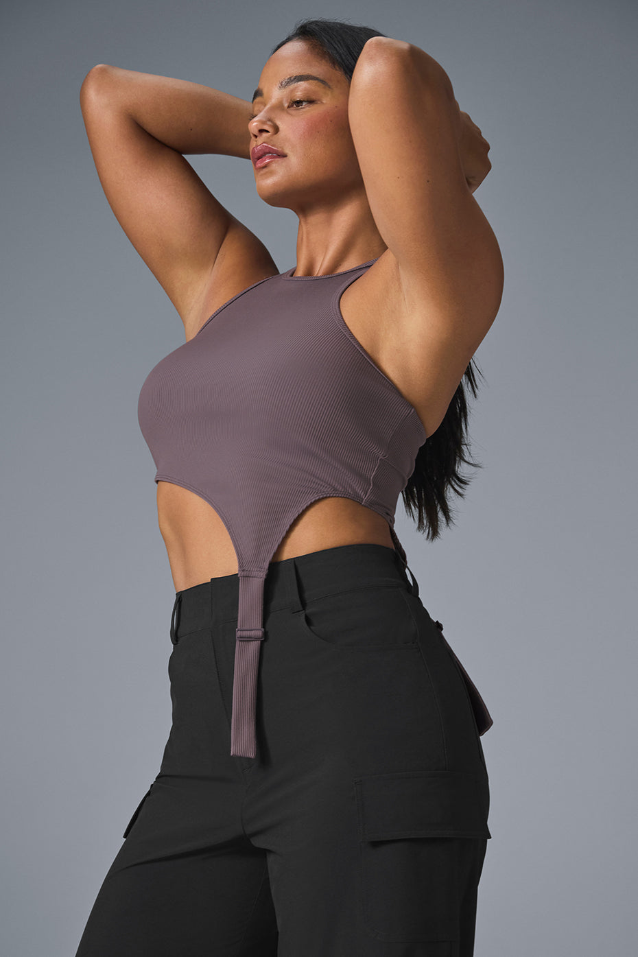Front view of the asymmetric tank top with buckle straps in Raisinette color