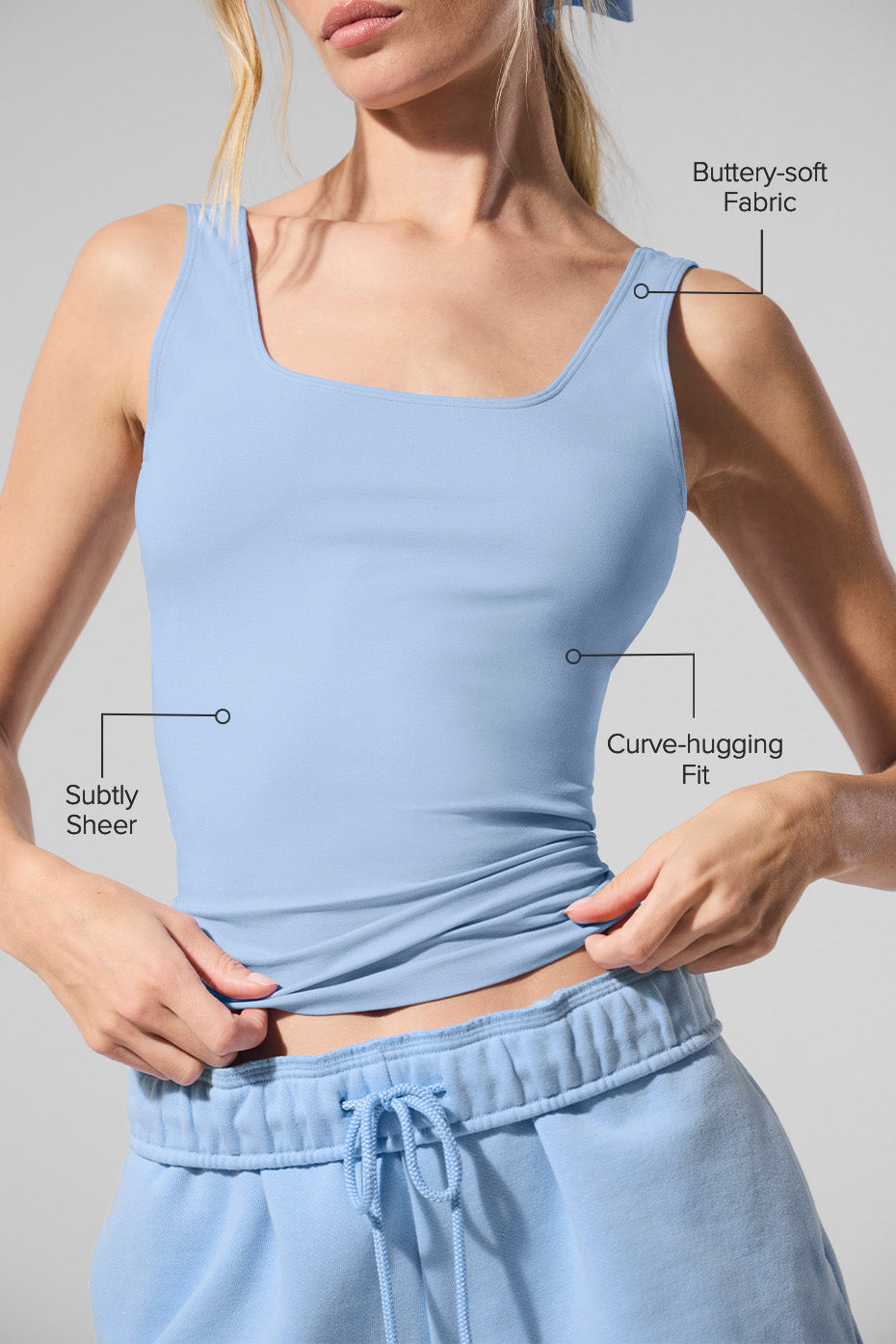 Side angle of the tank top worn with stylish jeans for a casual look.