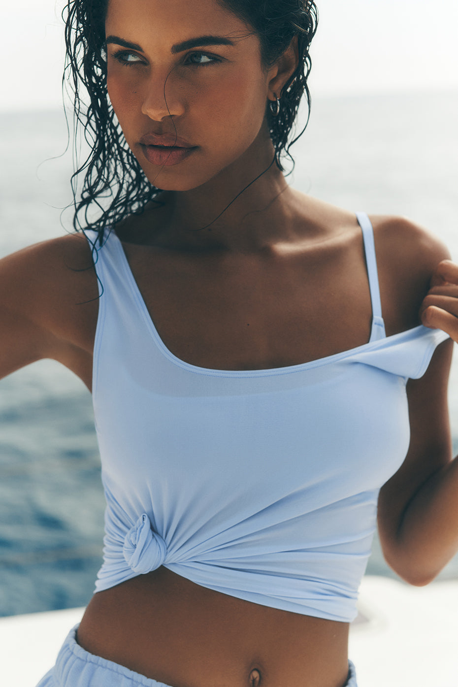 Front view of the seashell blue tank top, showcasing its lightweight design.