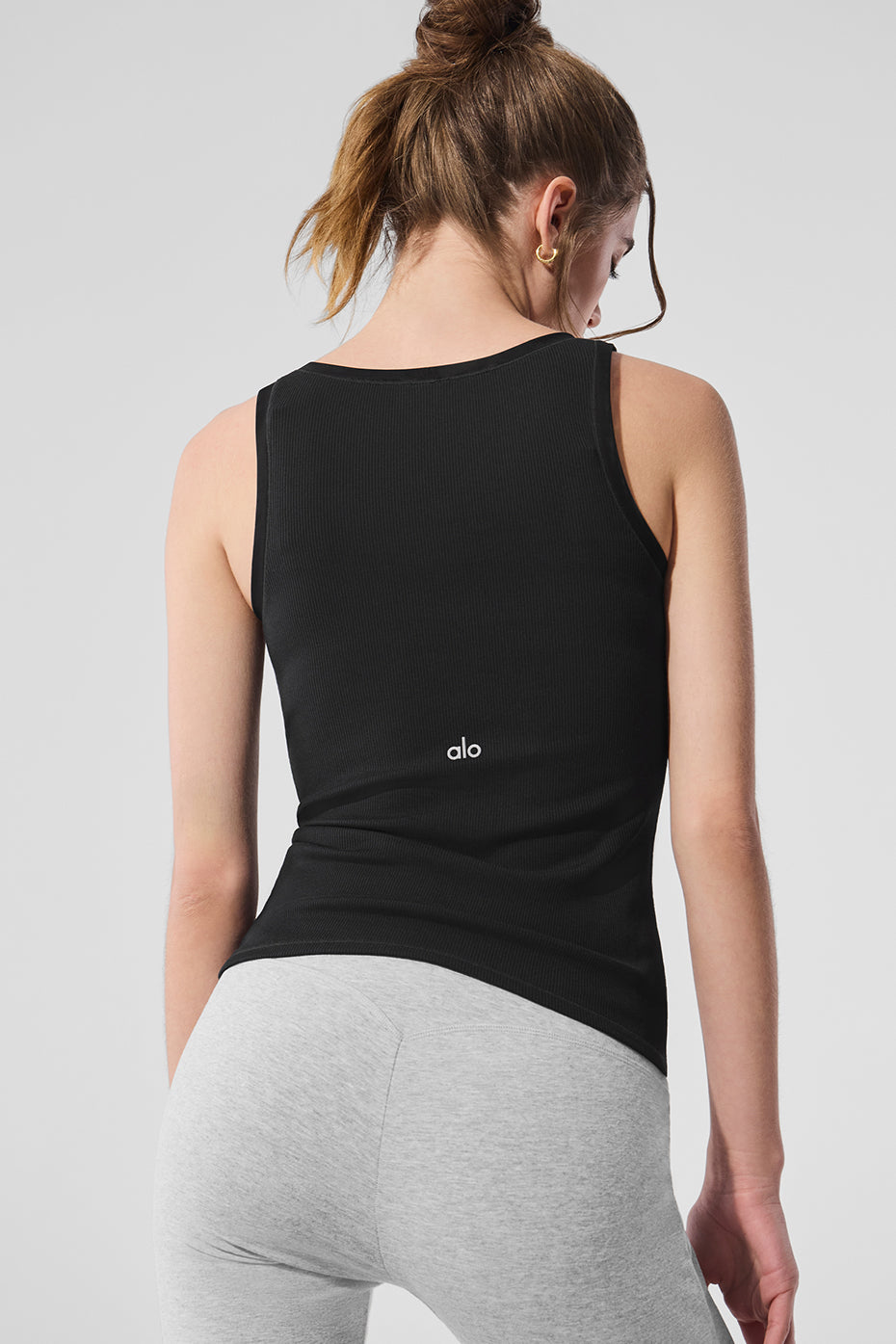 Side-by-side comparison of ribbed tank versus plain cotton version