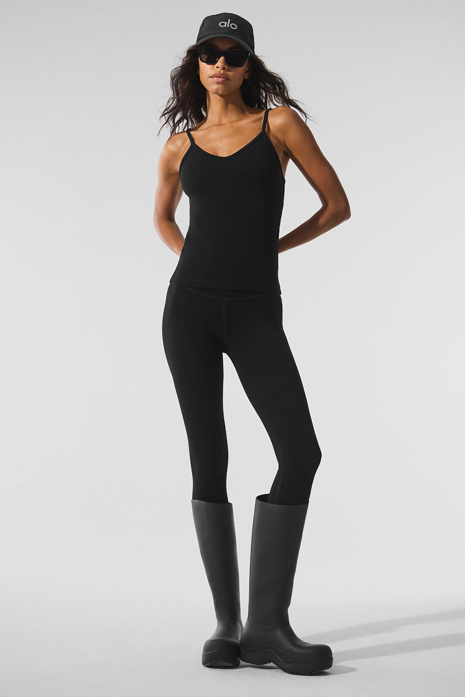 Front view of black plush tank styled for winter fitness
