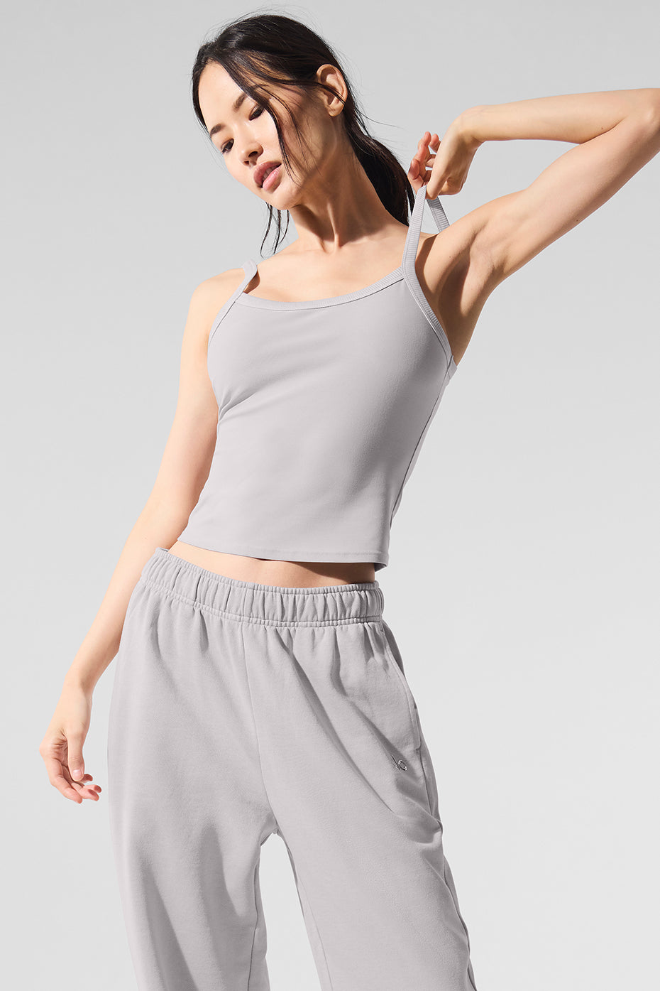 Side view showcasing the contrast rib detailing on the Alo Yoga tank top.