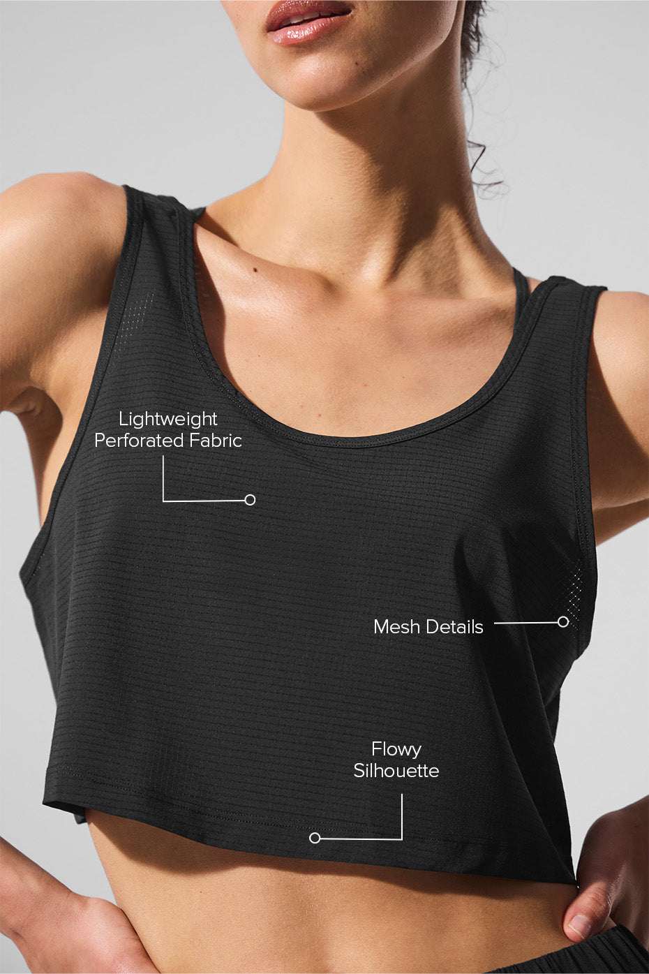 Side view showing the flowy silhouette of the cropped long sleeve workout top.