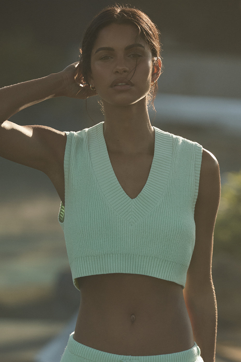 Breezy knit tank top in spearmint, ideal for beach wear.