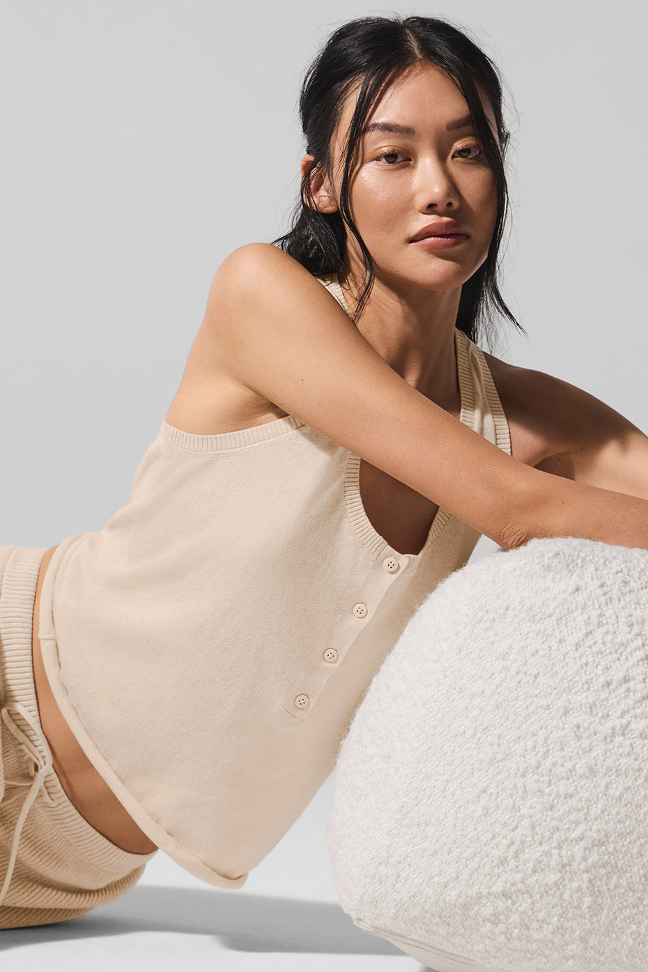 Model wearing the womens sweater tank, perfect for a casual day out.