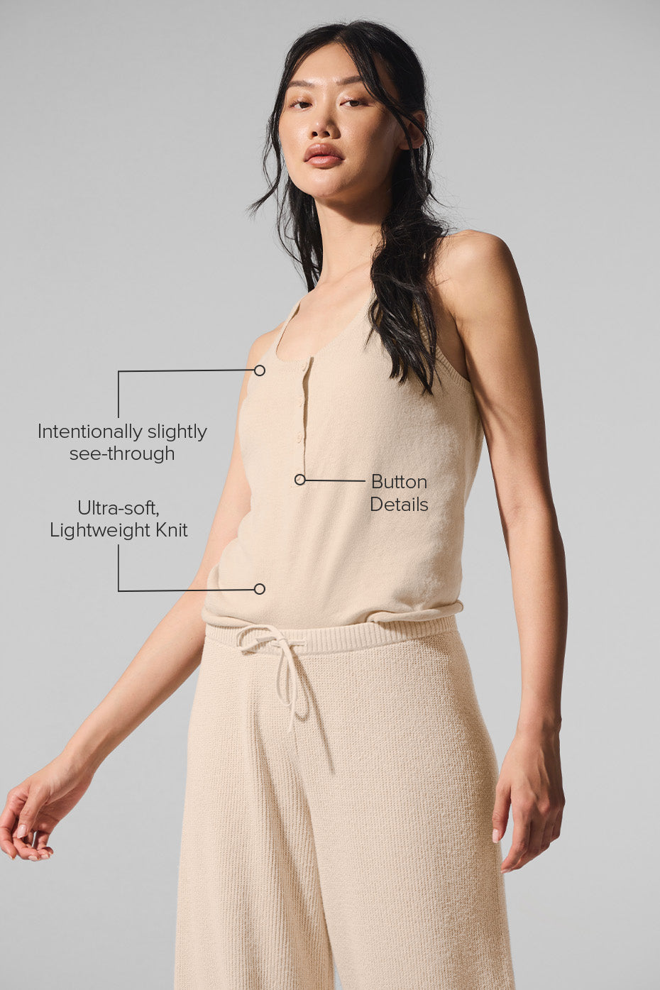 Close-up of the button details on the Henley tank, showcasing its relaxed fit.