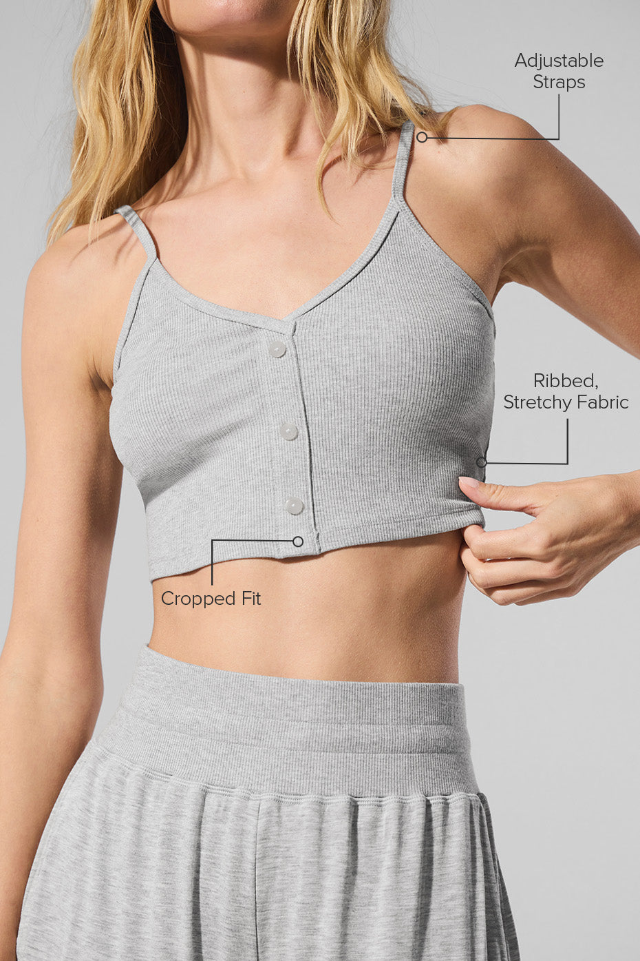 Model wearing the ribbed tank top paired with lounge pants.