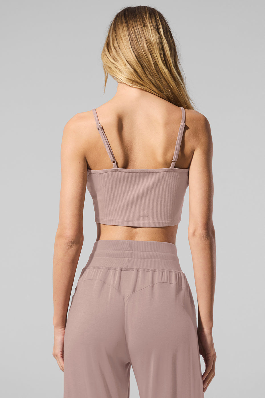 Taupe ribbed lounge tank top displayed on a mannequin, highlighting its textured knit and V-neck design.