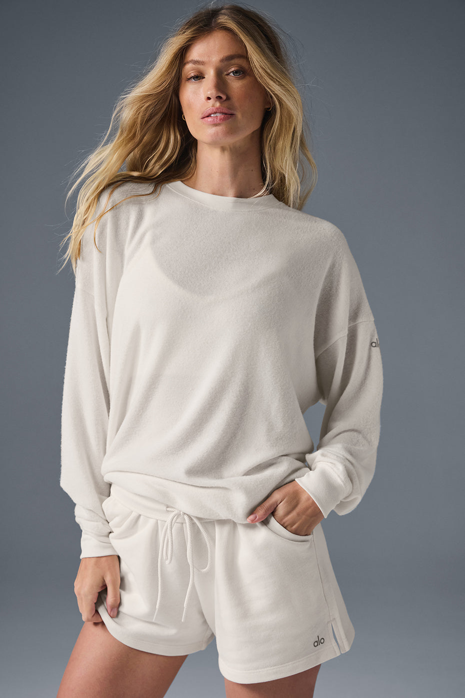 Front view of ivory pullover sweater worn casually with denim