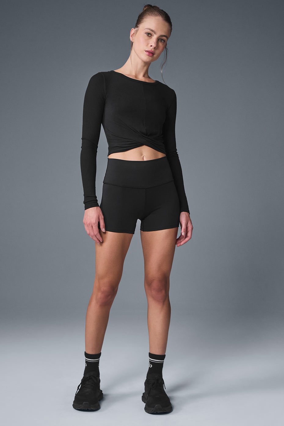 Model wearing the crop shirt top during a workout session.