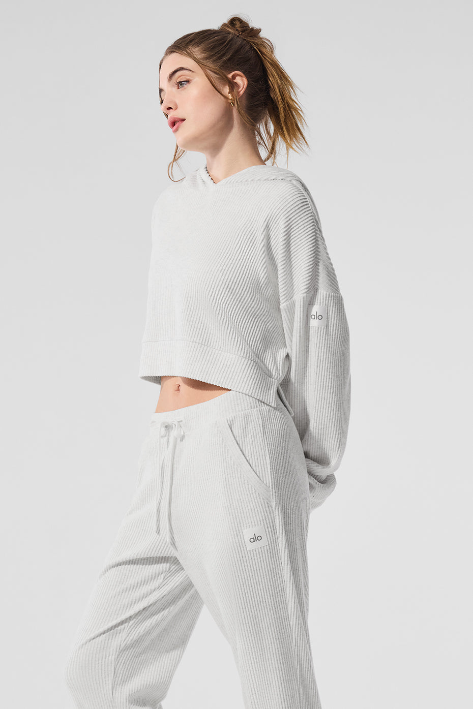 Front view of the Muse Comfort Hoodie in white heather, highlighting its soft fabric and cropped design.
