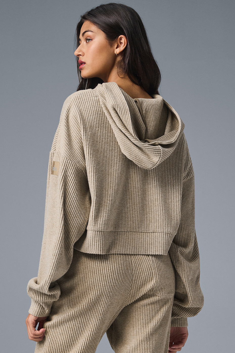 Close-up of ribbed knit fabric showing texture and detailing on the comfort hoodie.