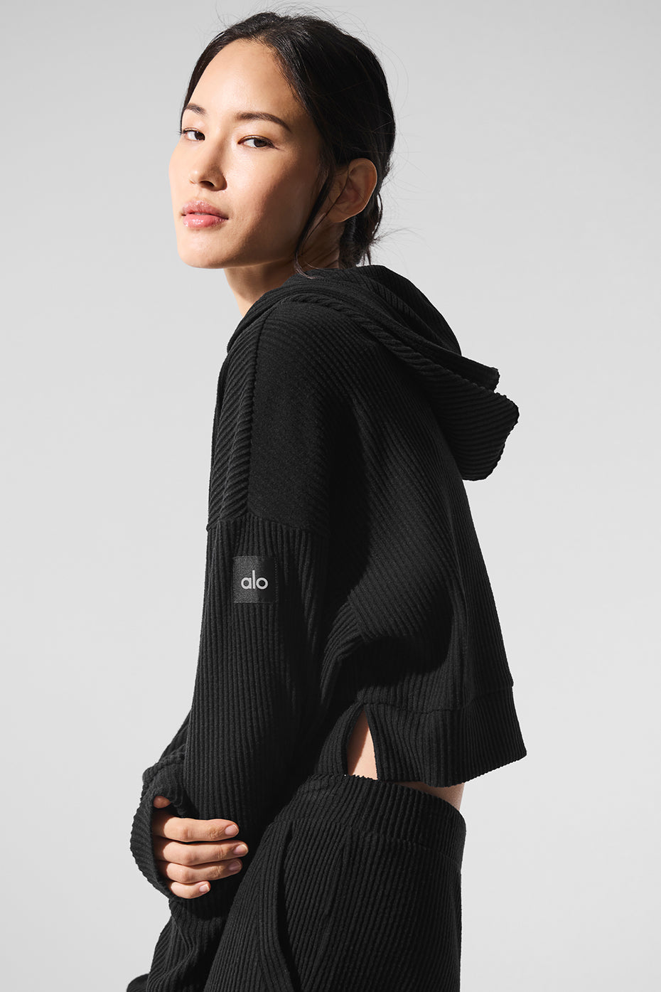 Close-up of the soft ribbed knit fabric of the Muse comfort hoodie in black