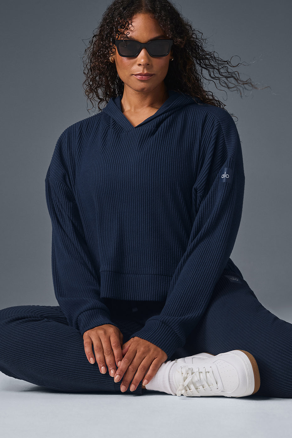 Woman wearing navy hoodie with casual maxi dress