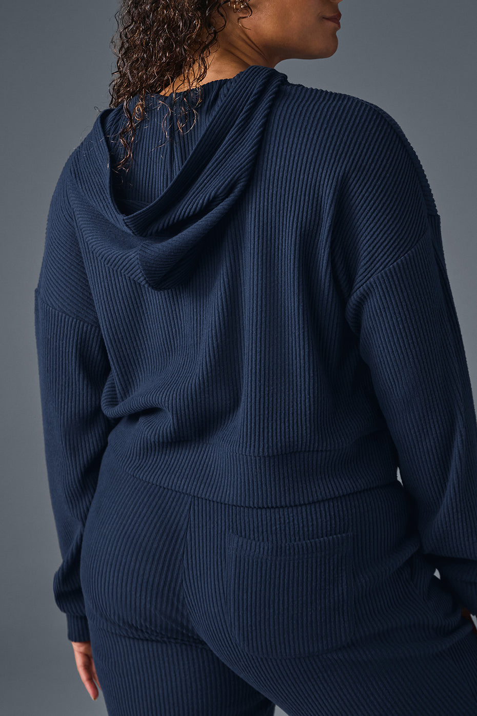 Side view showing relaxed fit and side slits