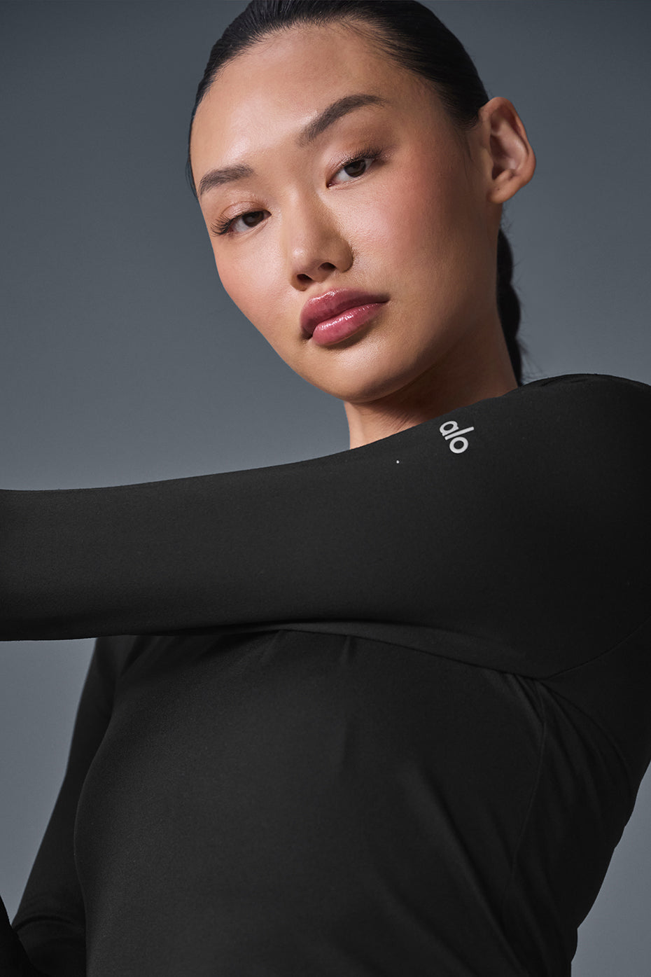 Close-up of the fabric texture of the long sleeve shirt in black
