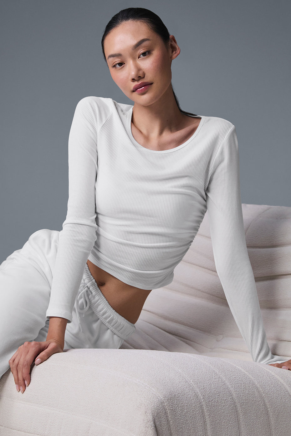Front view of the sheer long sleeve crop top, showcasing its ribbed texture.