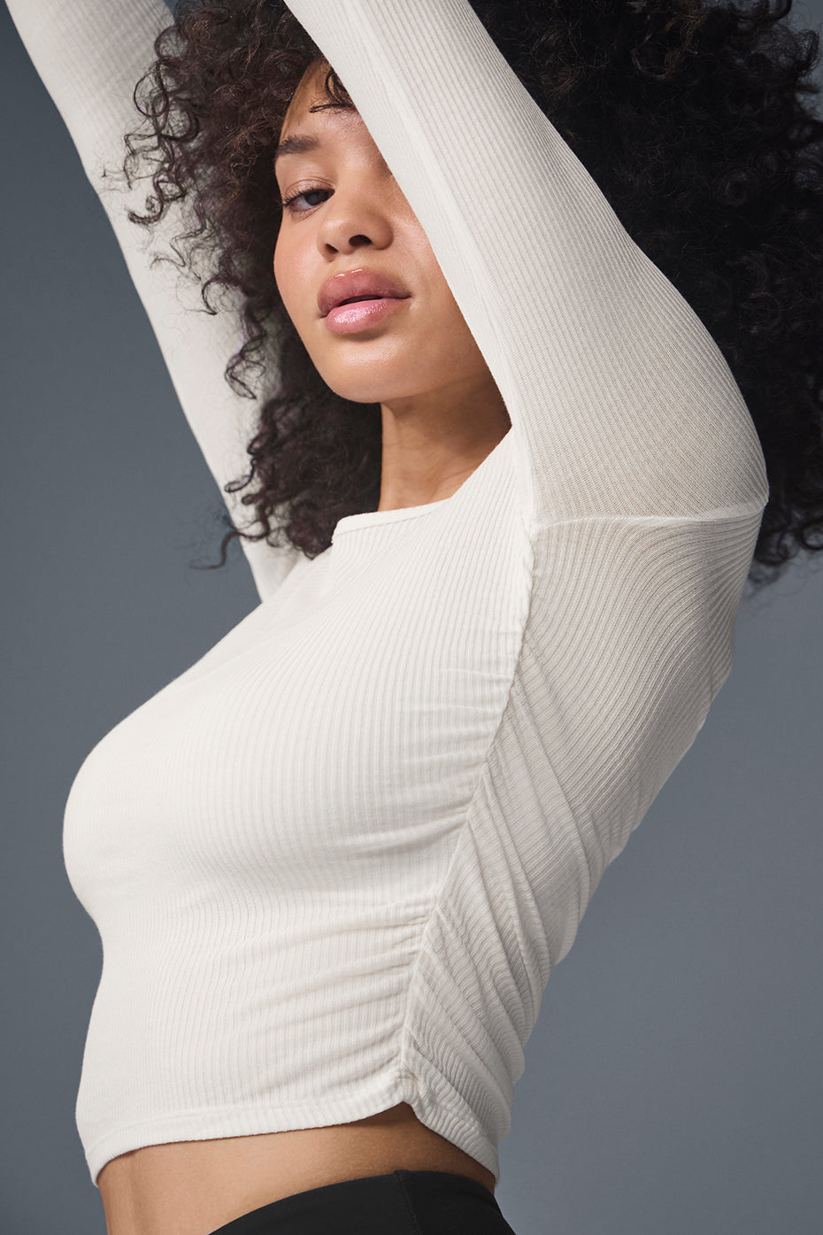 Close-up of the ruched sides on the womens long sleeve top