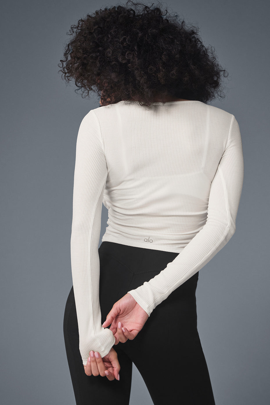 Model pairing ivory crop top with leggings for casual wear