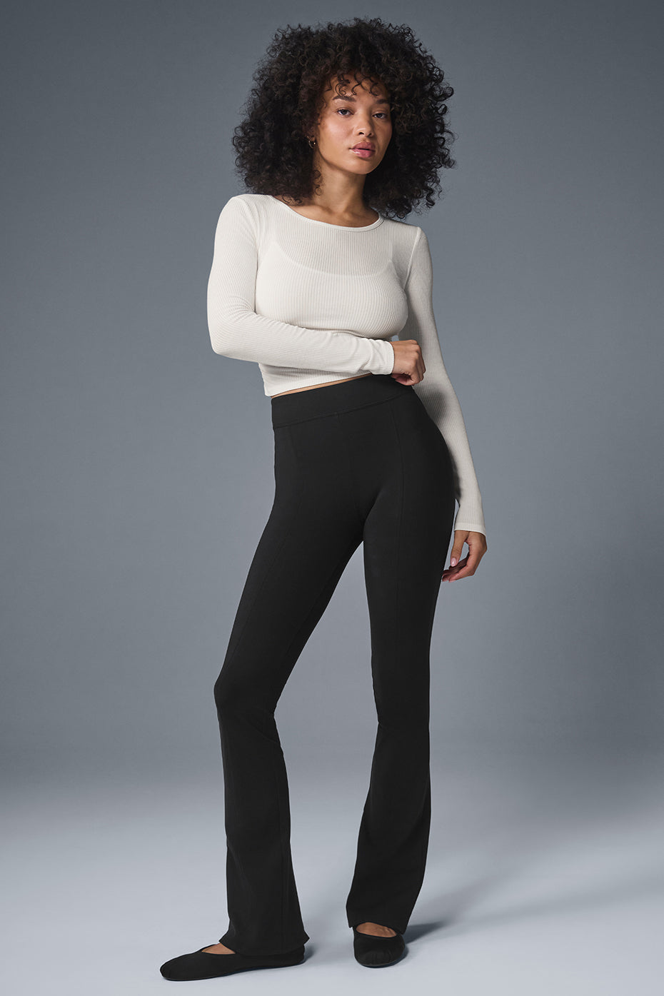 Front view of ivory long sleeve crop top with ribbed texture and cropped fit