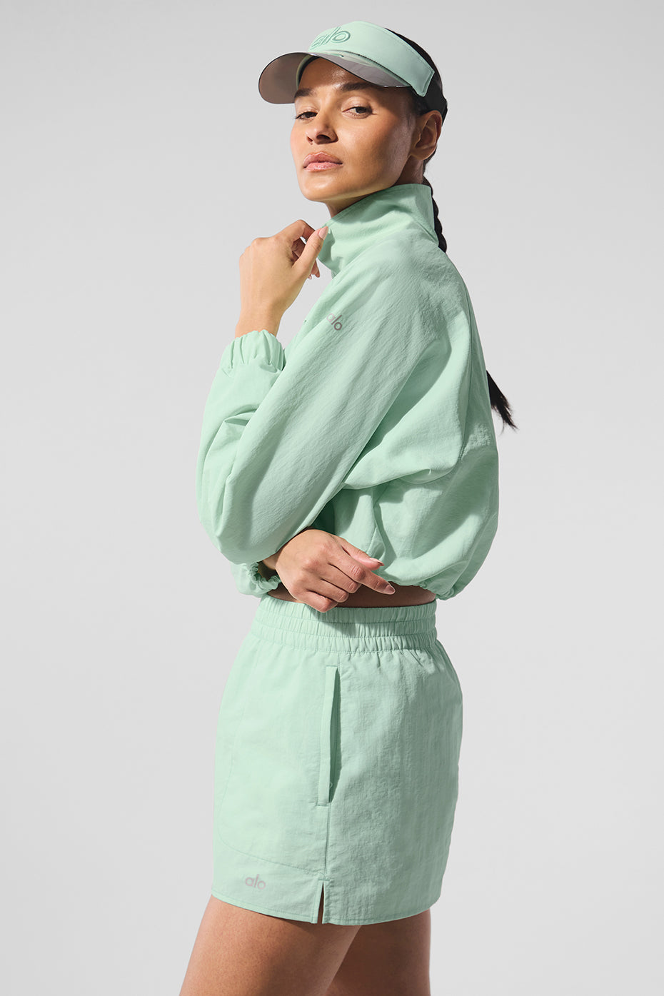 Model wearing the chic pullover with a tennis skirt.